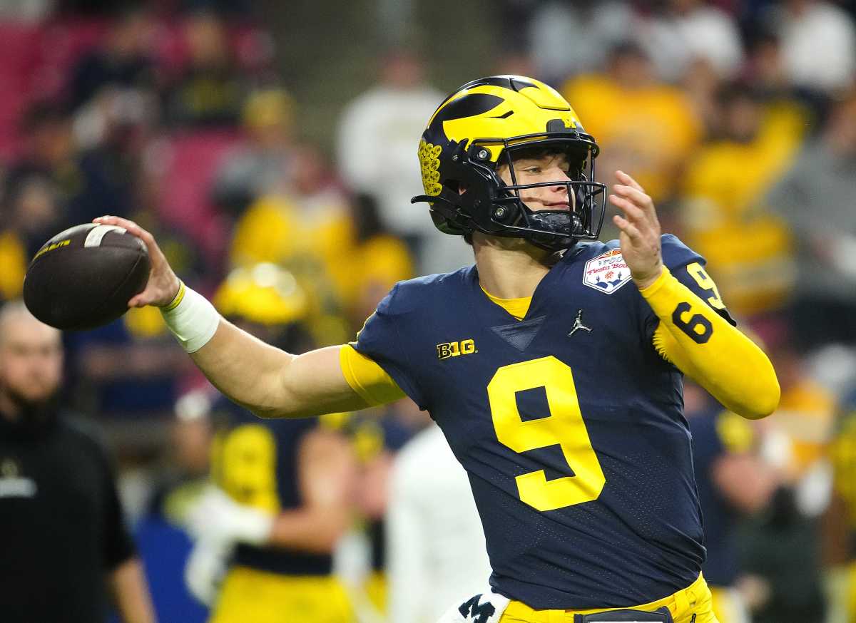 December 31, 2022; Glendale, Ariz; USA; Michigan quarterback JJ McCarthy (9) throws a pass during the pregame before the Fiesta Bowl at State Farm Stadium. Ncaa Fiesta Bowl Game